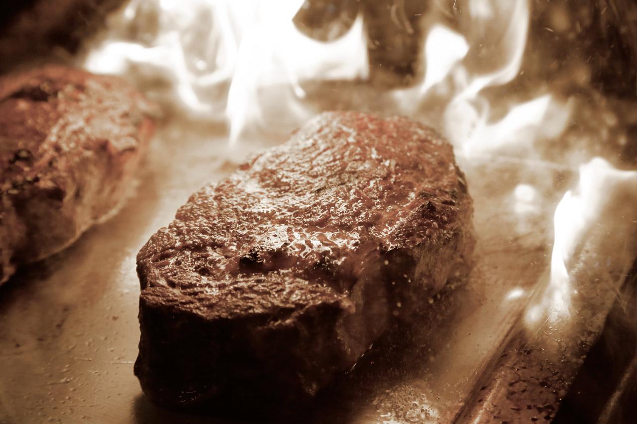 Grand Elysee Hamburg Exterior photo A steak being cooked