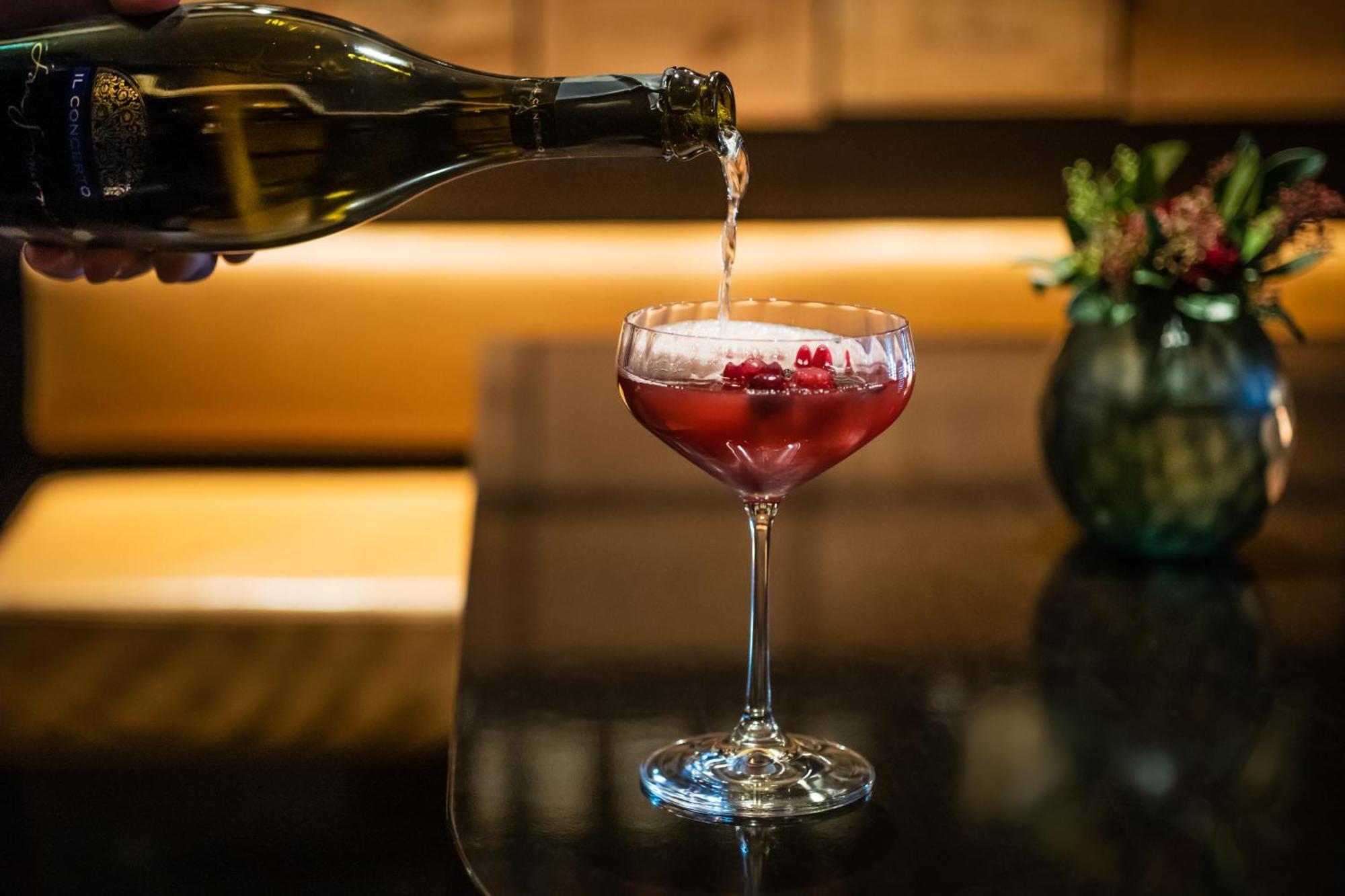 Grand Elysee Hamburg Exterior photo A Kir Royale being topped with Champagne